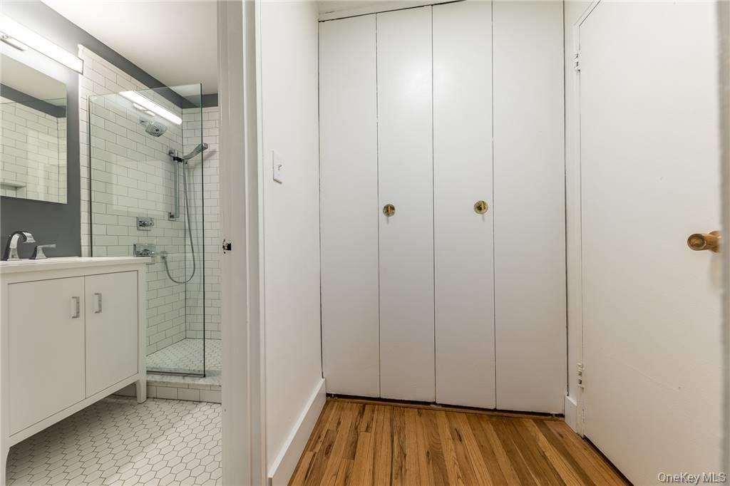 522 Shore Road, Unit 4A Long Beach, NY 11561 - Photo 14 of 32 a bathroom with a sink and a mirror