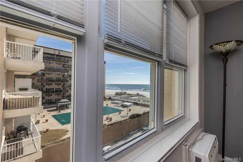 a view of a porch with a floor to ceiling window