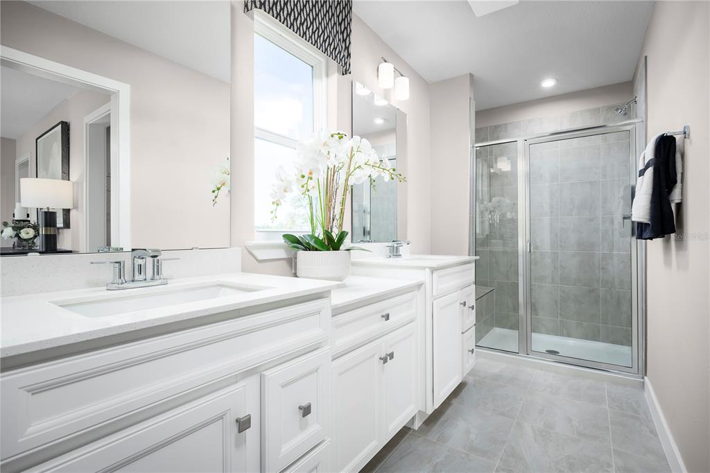 31391 Spanish Msn Road San Antonio, FL 33576 - Photo 14 of 26 a spacious bathroom with a double vanity sink mirror and shower