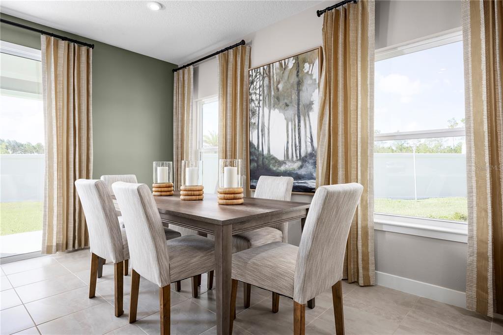 31391 Spanish Msn Road San Antonio, FL 33576 - Photo 10 of 26 a view of a dining room with furniture and a window