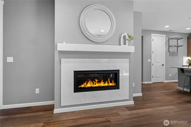 a living room with furniture a fireplace and a fireplace