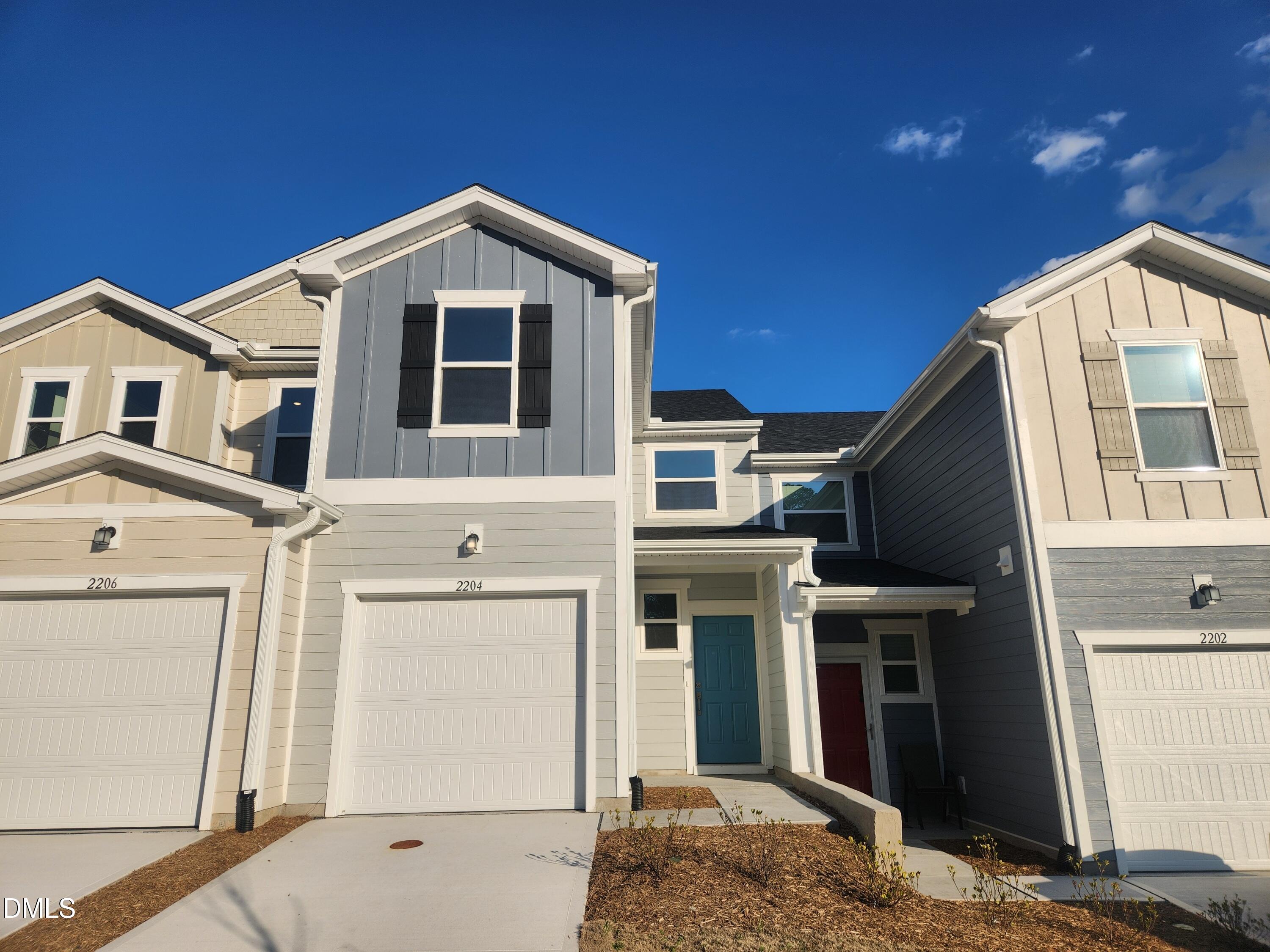 a front view of a house with a garage