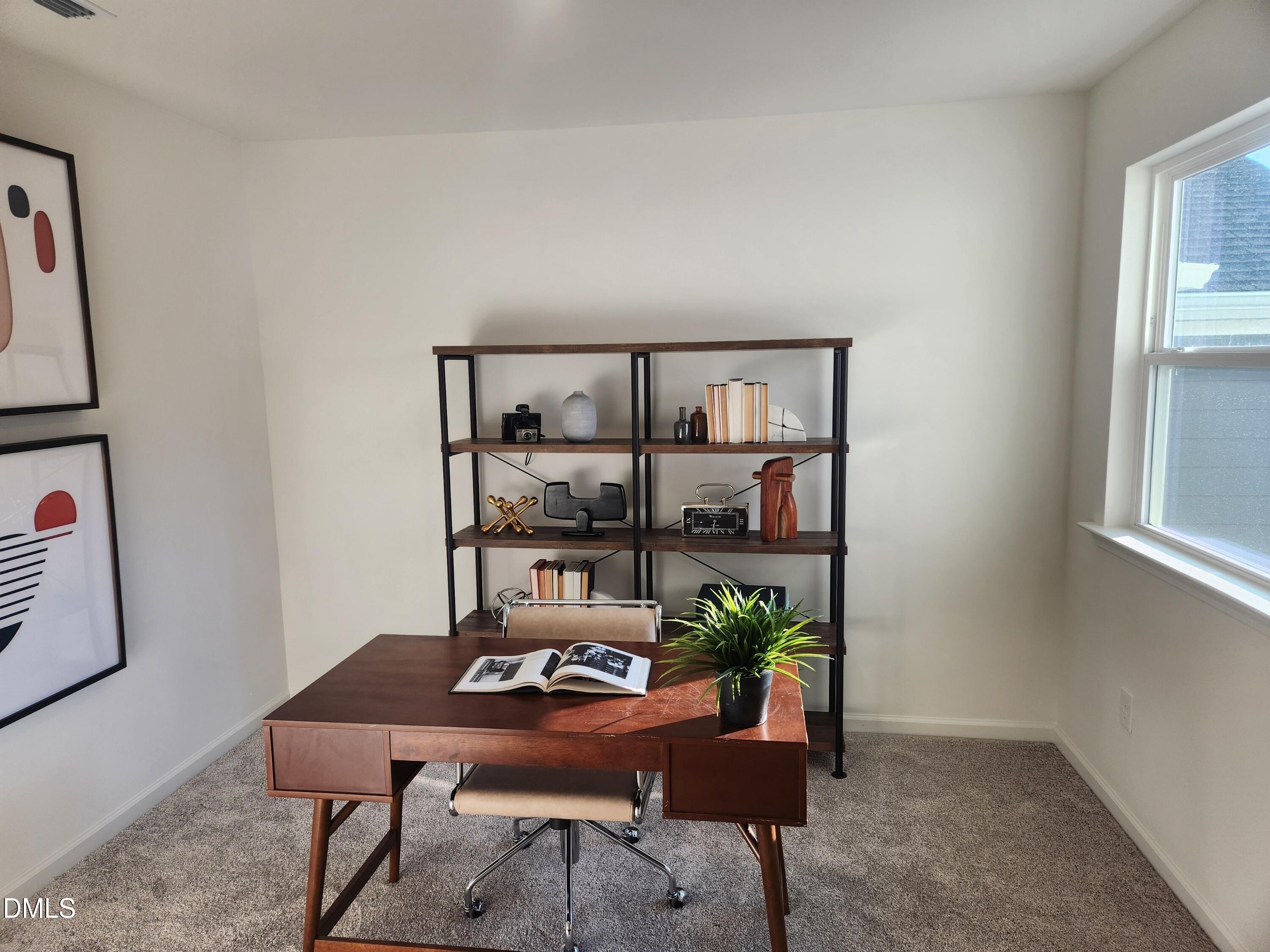 2204 Rabbitbrush Street Durham, NC 27704 - Photo 12 of 21 a workspace with furniture and window