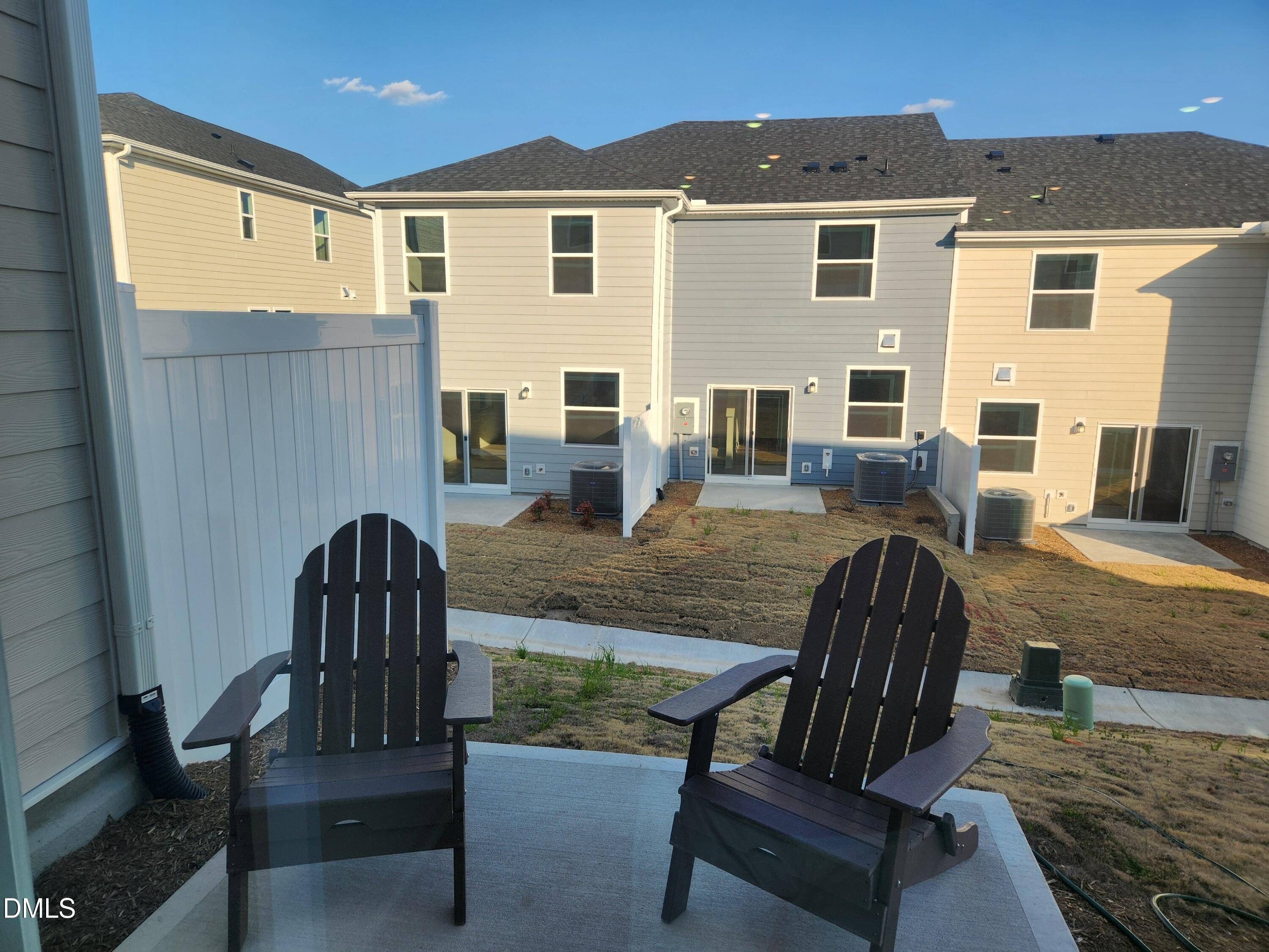 2204 Rabbitbrush Street Durham, NC 27704 - Photo 14 of 21 a view of a patio with couches chairs and wooden floor