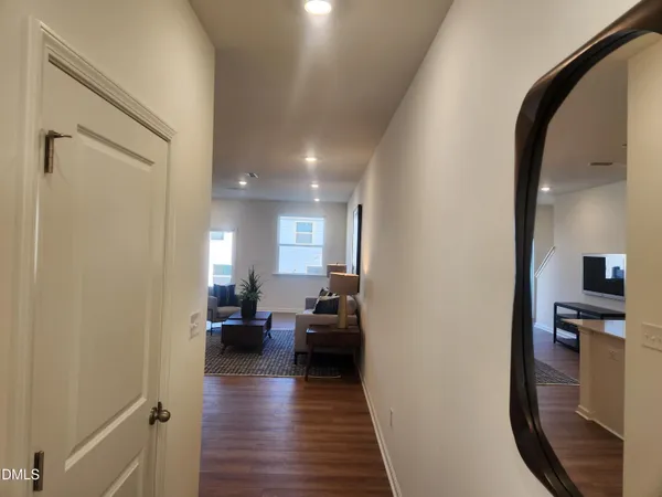 a view of a living room with a wooden floor