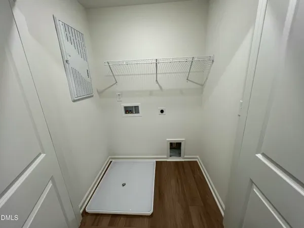 a view of storage and utility room with racks on the wall
