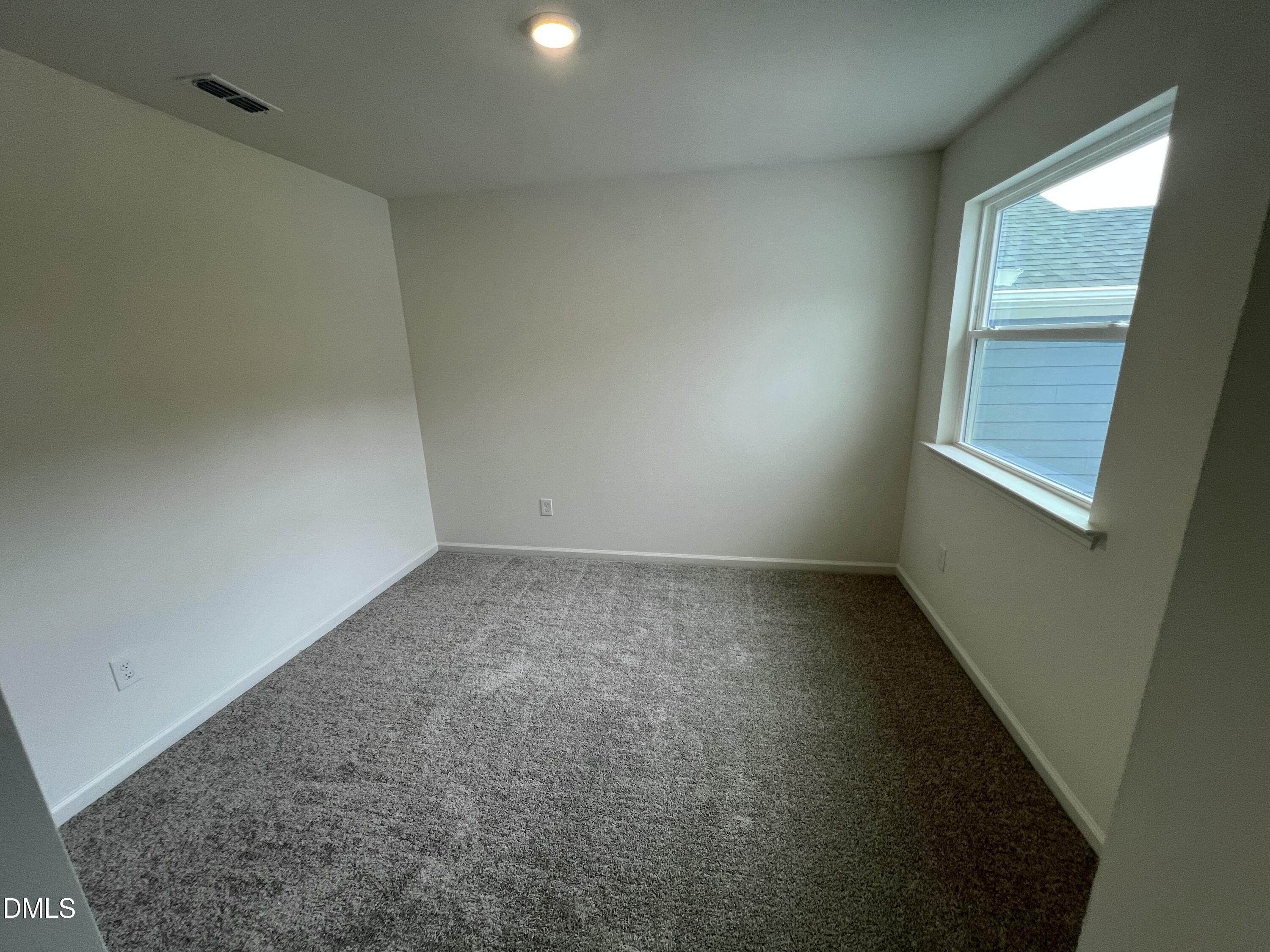 2204 Rabbitbrush Street Durham, NC 27704 - Photo 8 of 21 an empty room with a window
