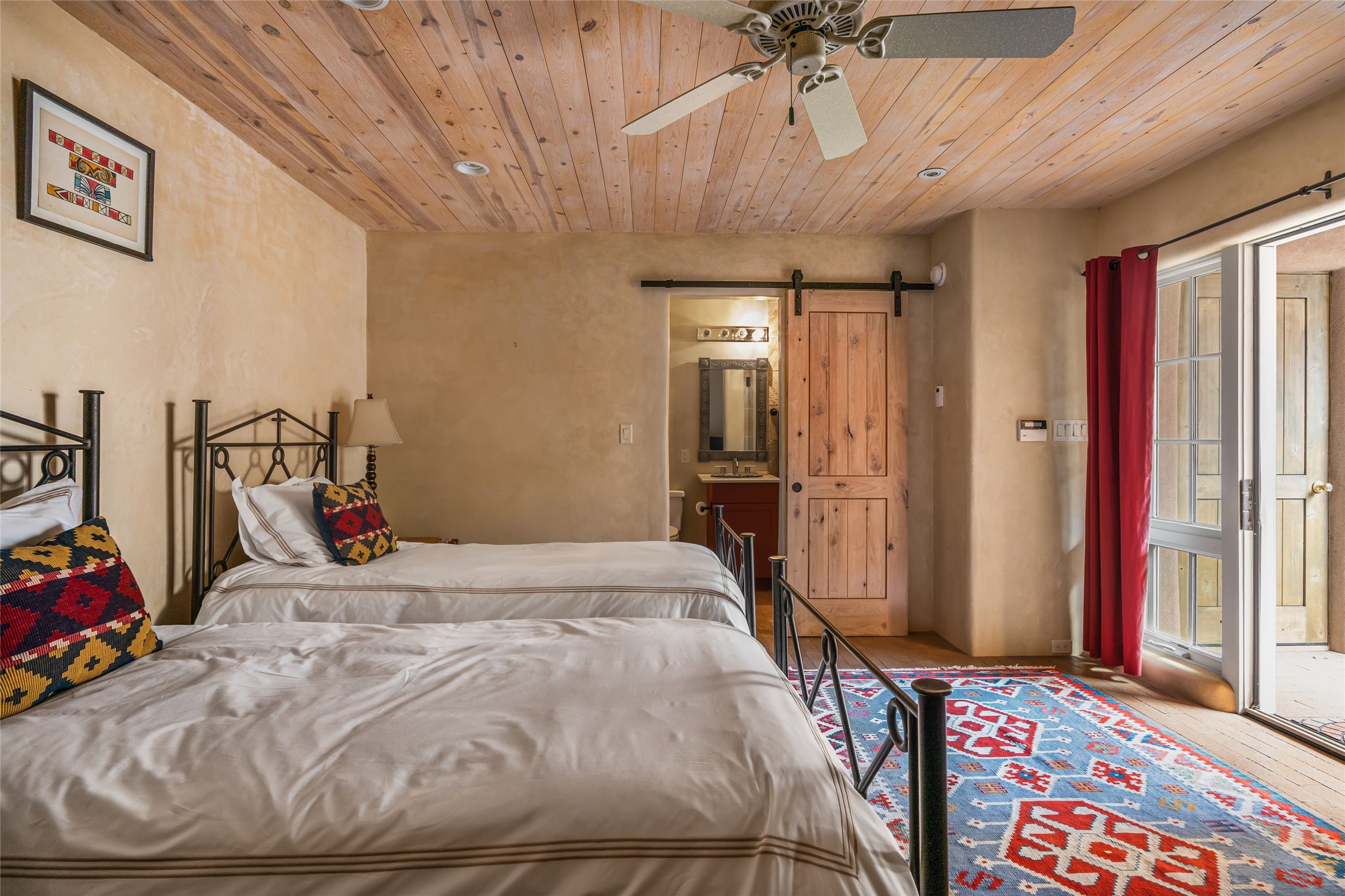 1 Cerro Gordo Road, Unit B Santa Fe, NM 87501 - Photo 18 of 25 Second bedroom and bath with additional exterior French doors.