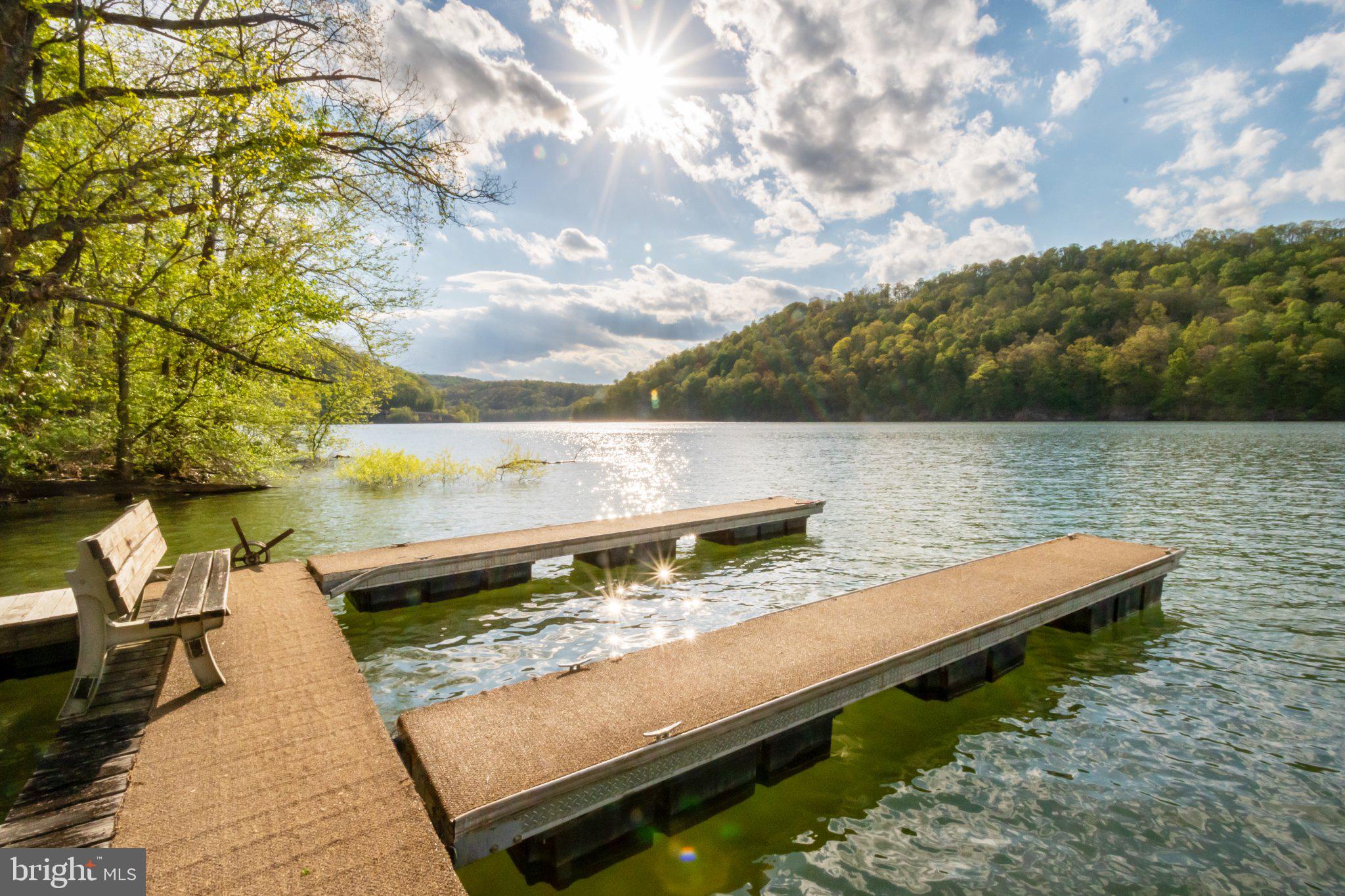 750 Lake Side Road Addison, PA 15411 - Photo 13 of 51 Serene lakeside retreat at sunset.