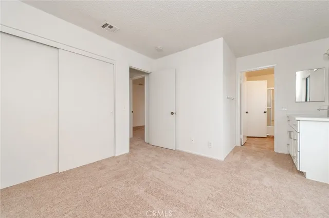 a view of a roof deck with wooden fence and floor