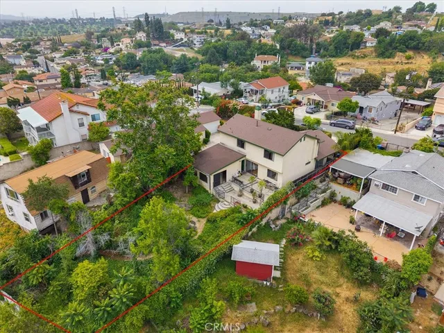 an aerial view of residential house with outdoor space and street view