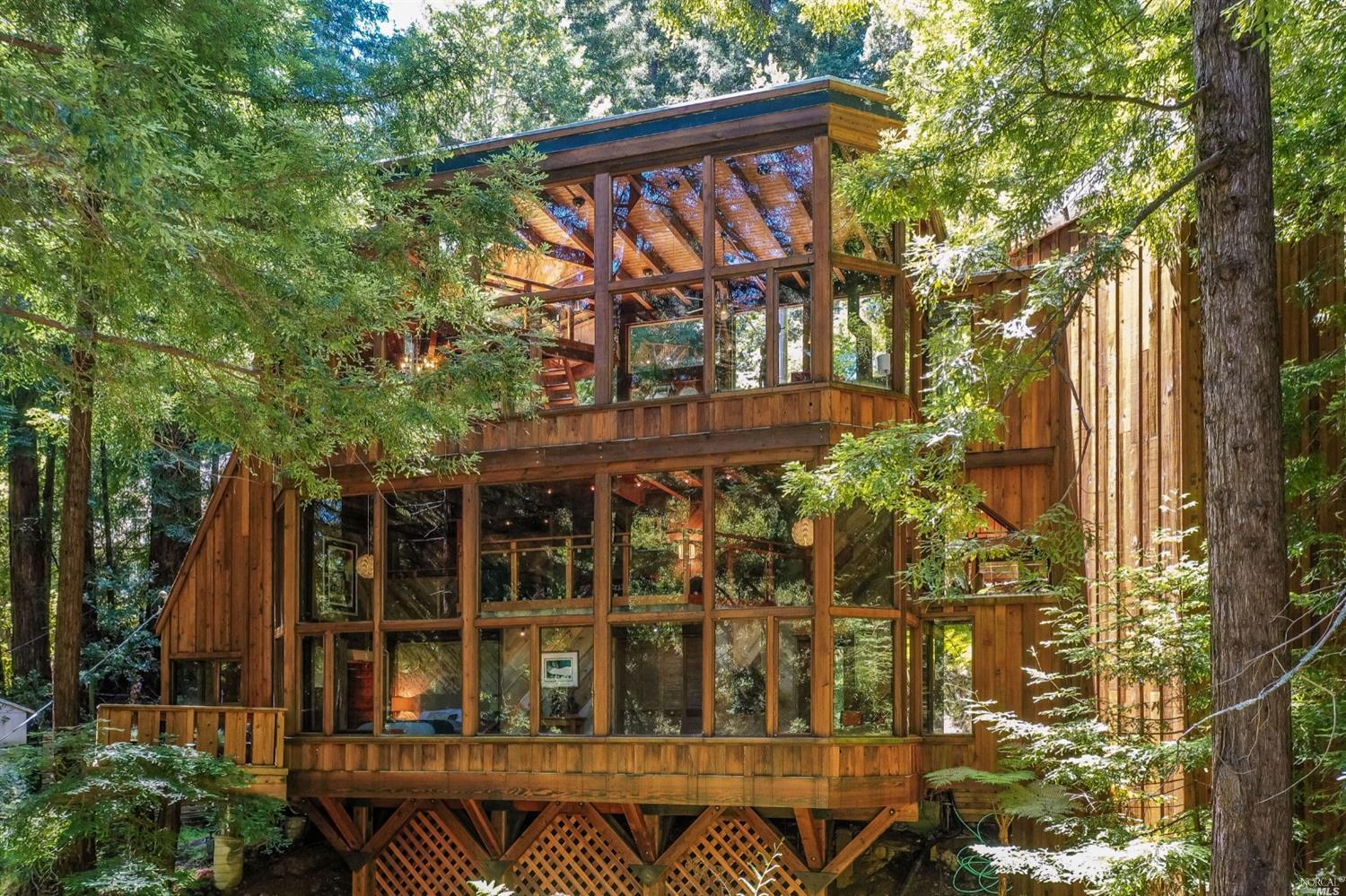 front view of a house with a tree