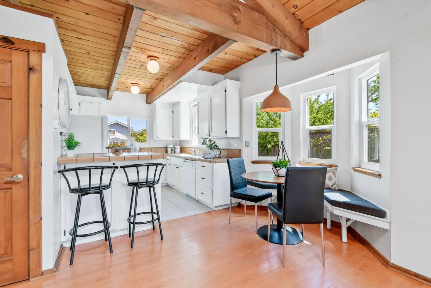 620 Sumner Street Santa Cruz, CA 95062 - Photo 8 of 45 a dining room with furniture a chandelier and wooden floor