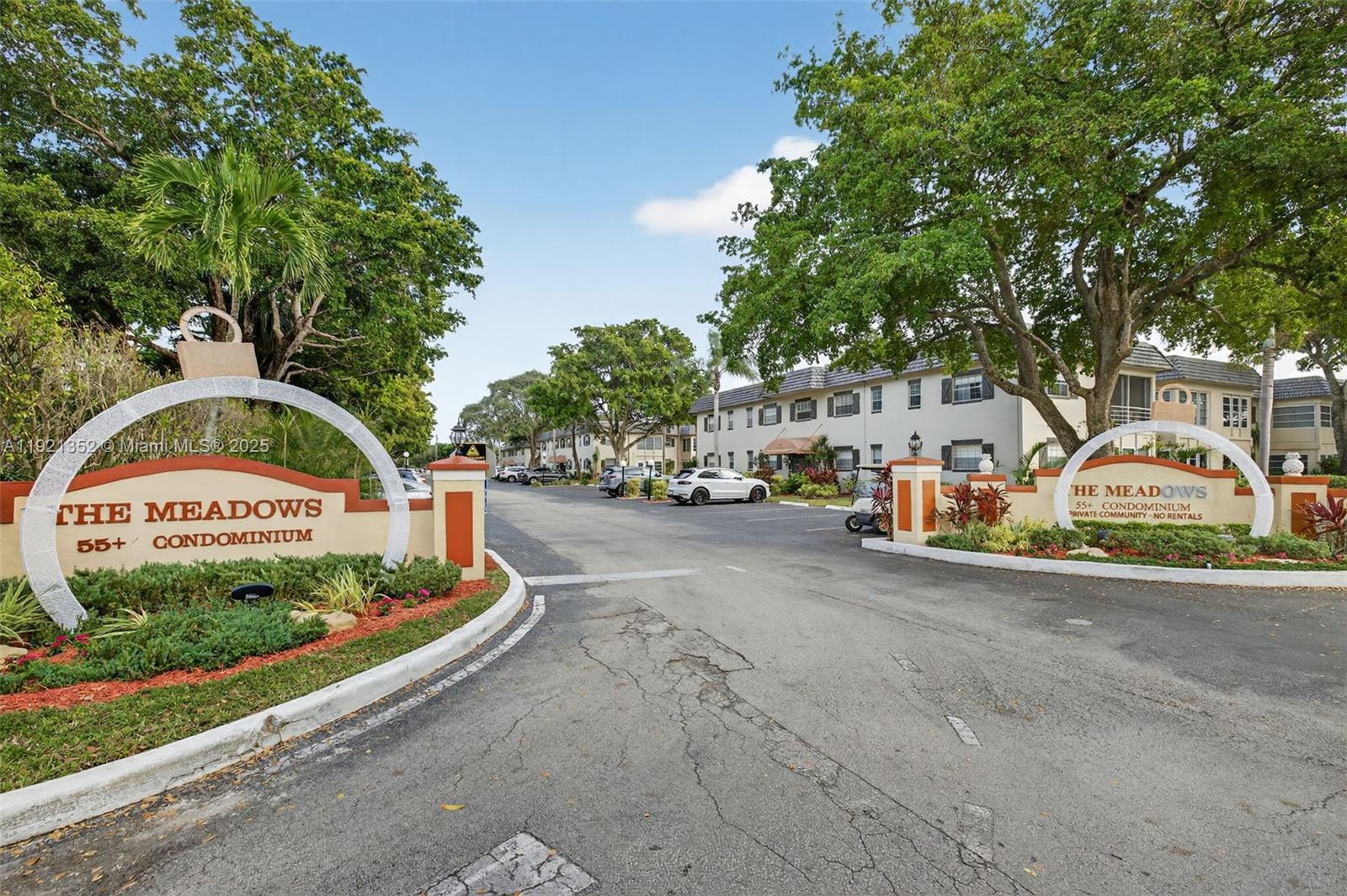 5681 Southwest 2nd Court, Unit 117 Margate, FL 33068 - Photo 1 of 26 a view of street with parked cars