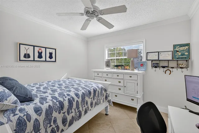 a bedroom with a bed and a desk