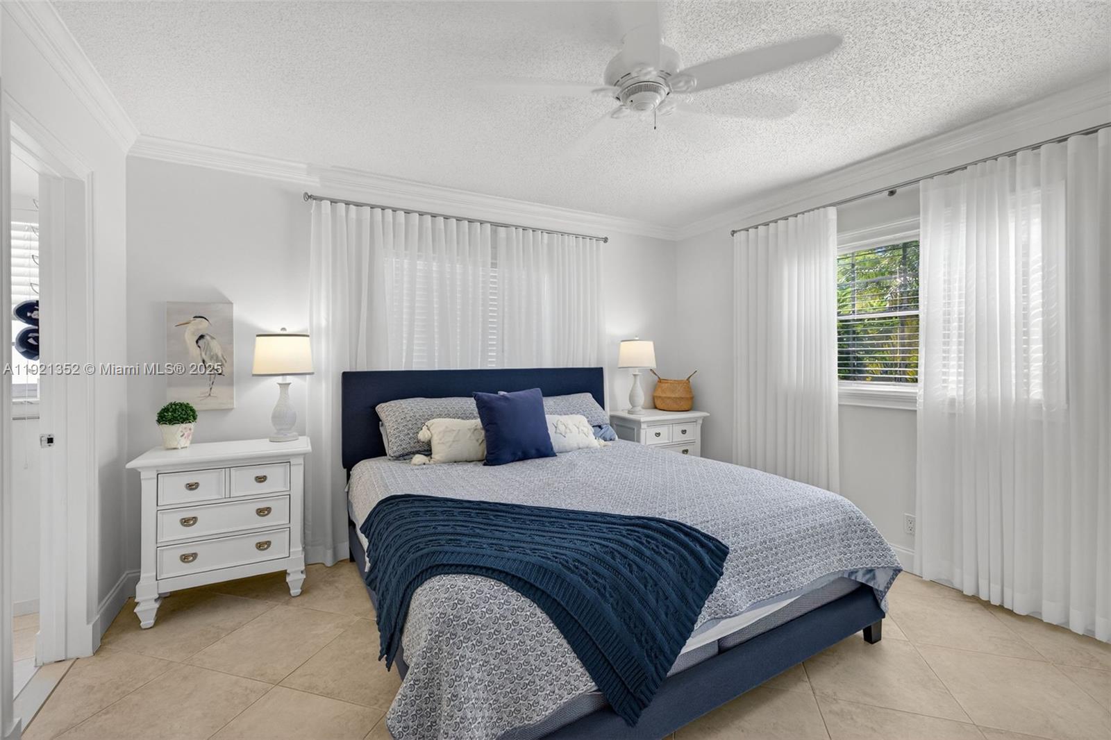 5681 Southwest 2nd Court, Unit 117 Margate, FL 33068 - Photo 15 of 26 a bedroom with a bed and a dresser