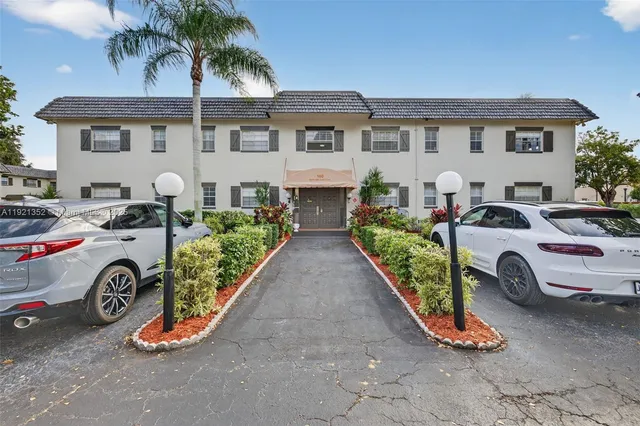 a view of a car park in front of house