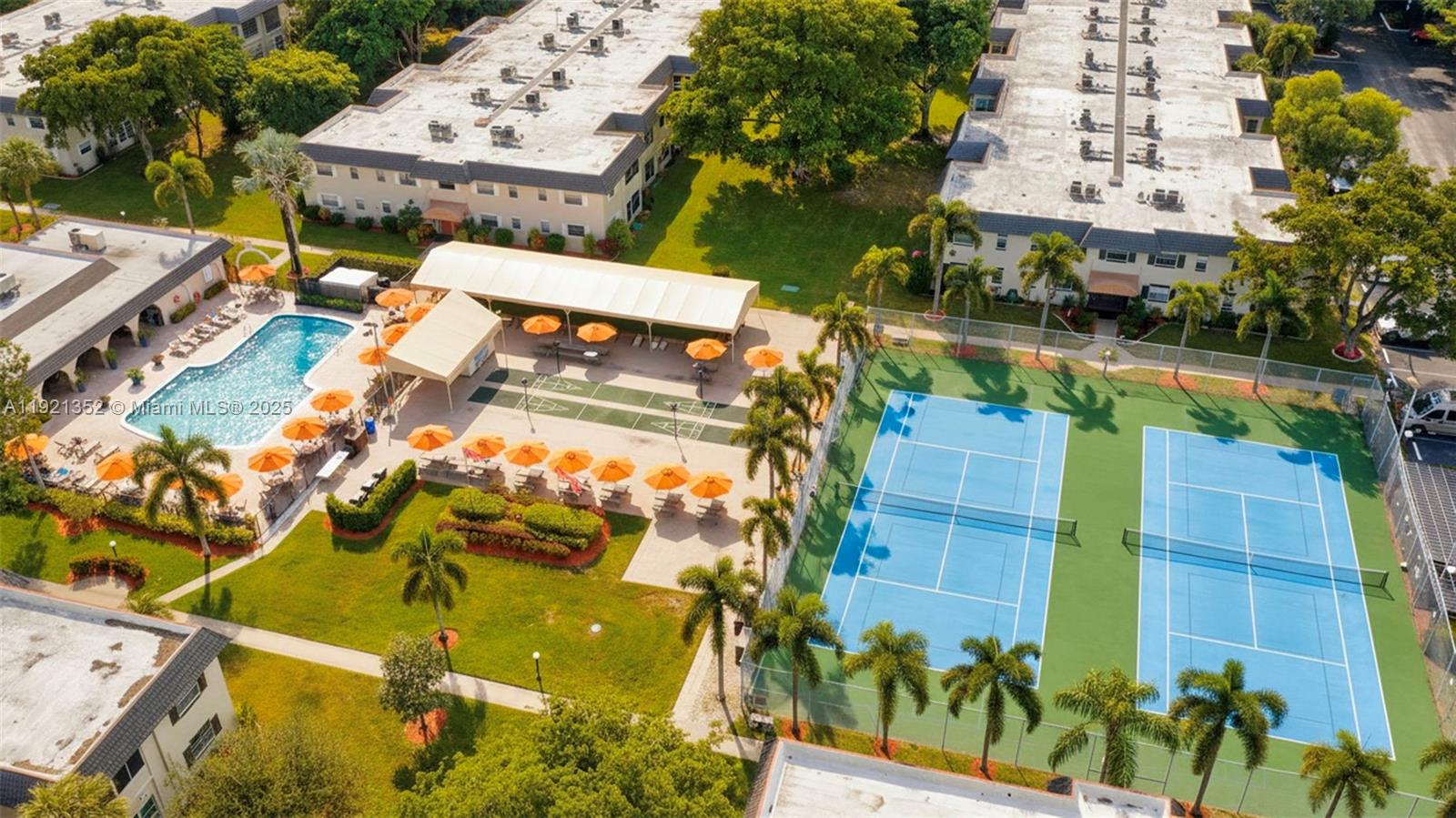 5681 Southwest 2nd Court, Unit 117 Margate, FL 33068 - Photo 26 of 26 an aerial view of a residential apartment building with a yard