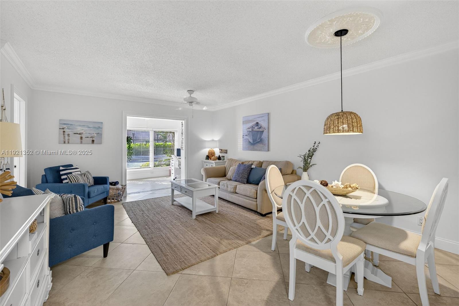 5681 Southwest 2nd Court, Unit 117 Margate, FL 33068 - Photo 4 of 26 a living room with furniture and a window