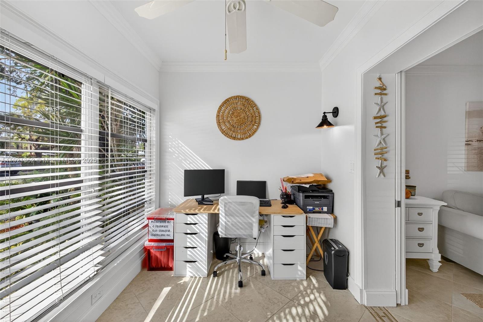 5681 Southwest 2nd Court, Unit 117 Margate, FL 33068 - Photo 7 of 26 a view of a workspace with furniture and a window