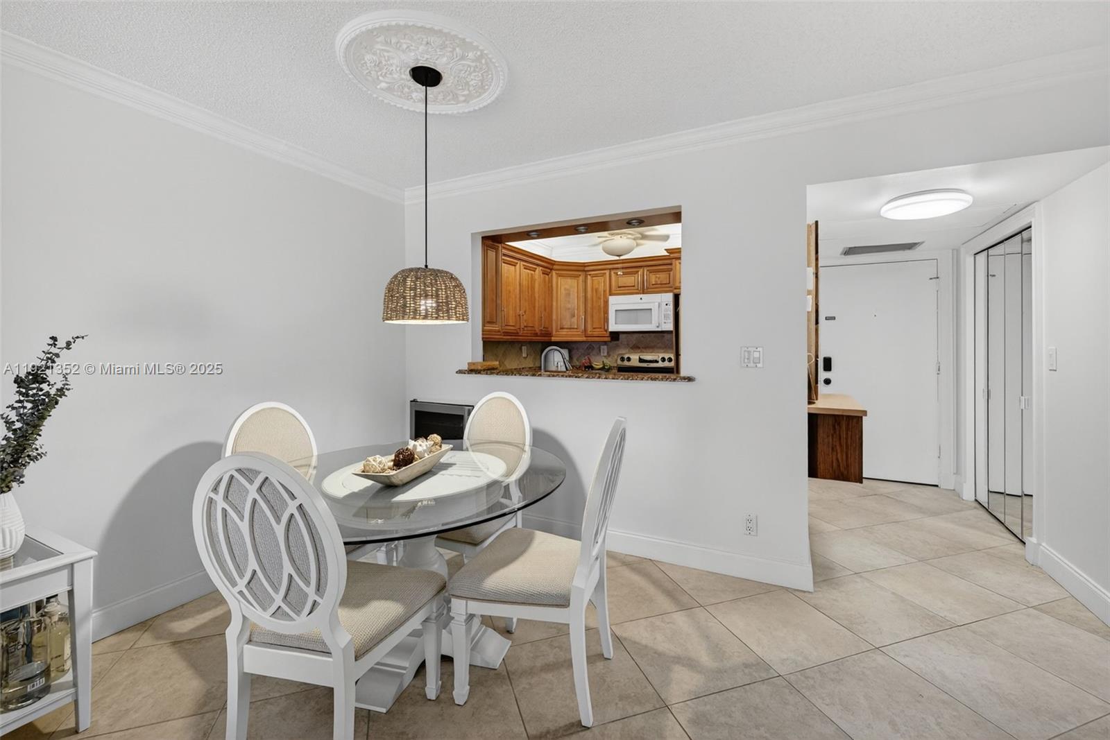 5681 Southwest 2nd Court, Unit 117 Margate, FL 33068 - Photo 9 of 26 a dining room with furniture and window