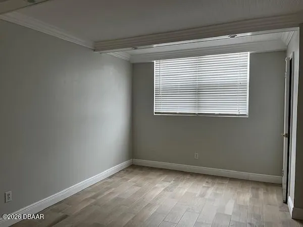 a view of an empty room with a window