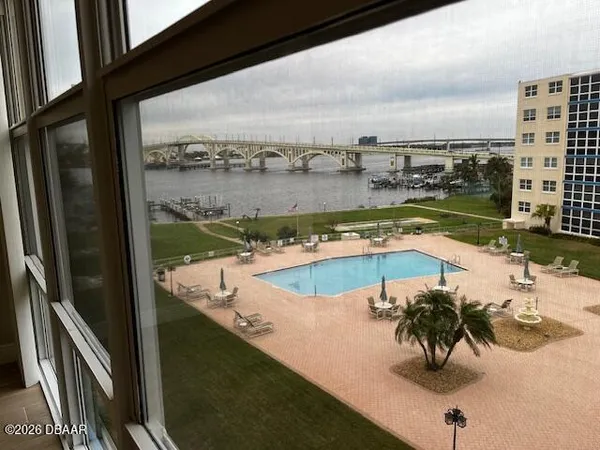 a view of a swimming pool with a terrace