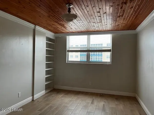 a view of an empty room with a window