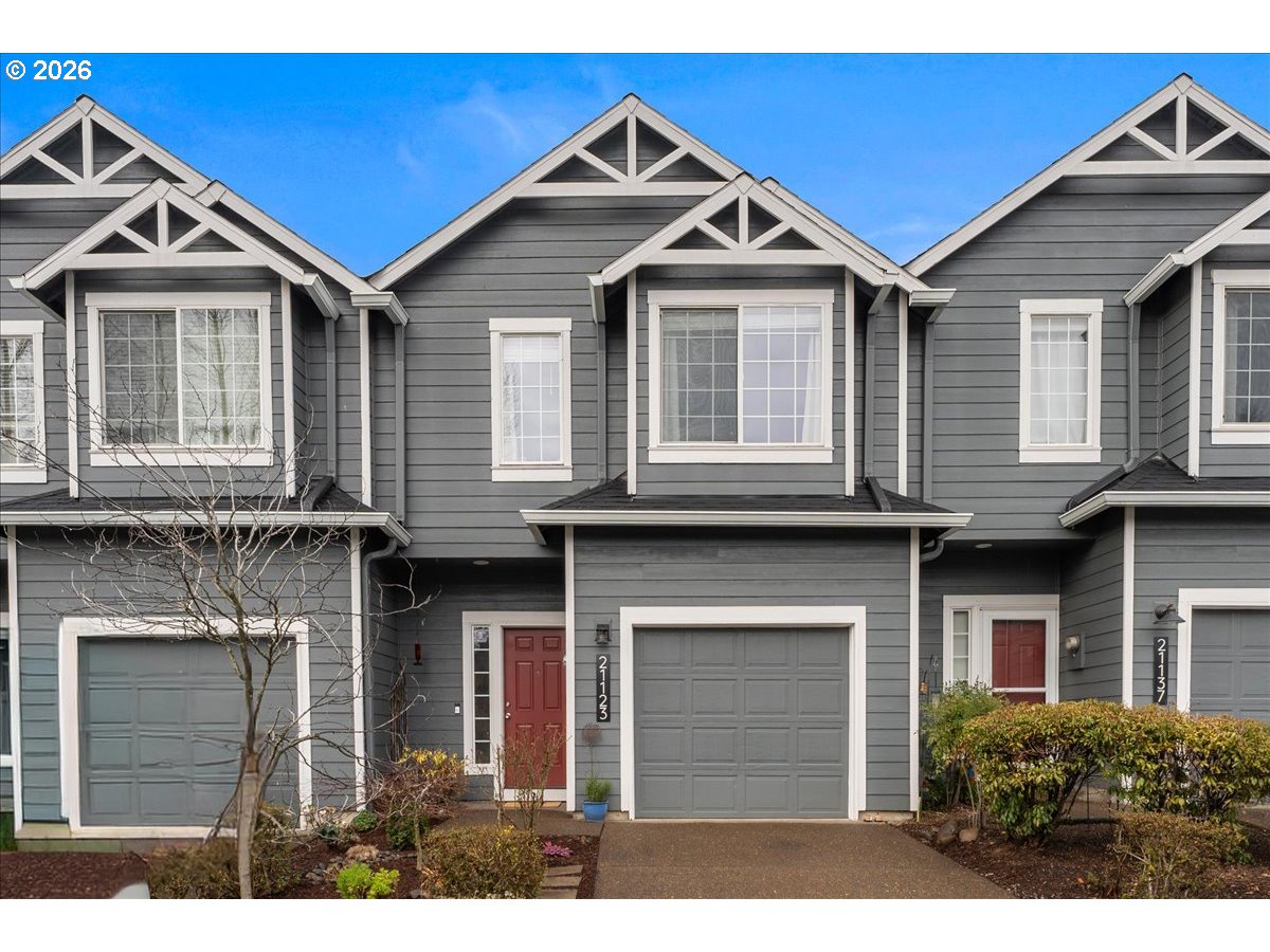 21123 Osburn Loop Fairview, OR 97024 - Photo 1 of 48 a front view of a house with a yard