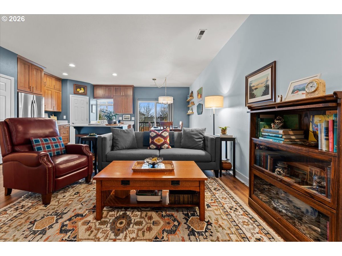21123 Osburn Loop Fairview, OR 97024 - Photo 18 of 48 a living room with furniture and a book shelf