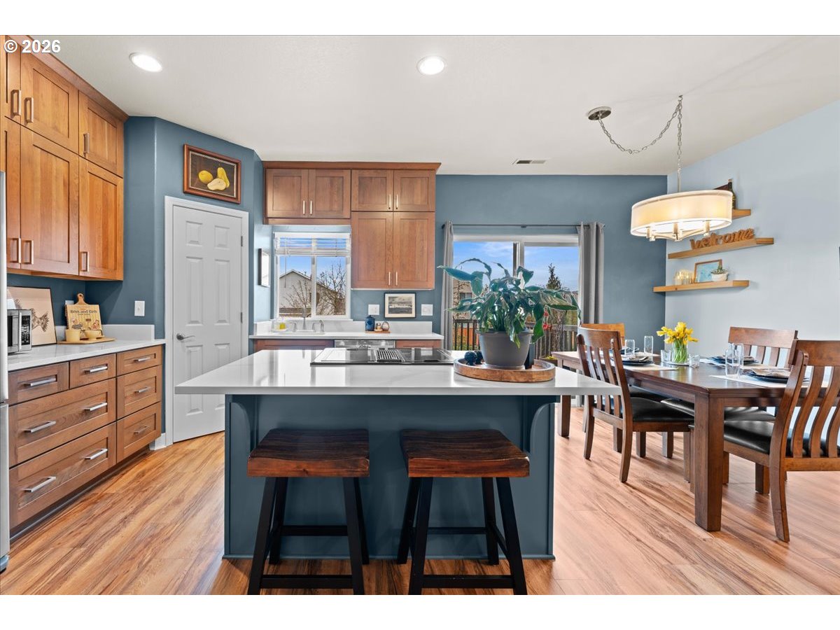 21123 Osburn Loop Fairview, OR 97024 - Photo 2 of 48 a room with stainless steel appliances kitchen island a table and chairs in it