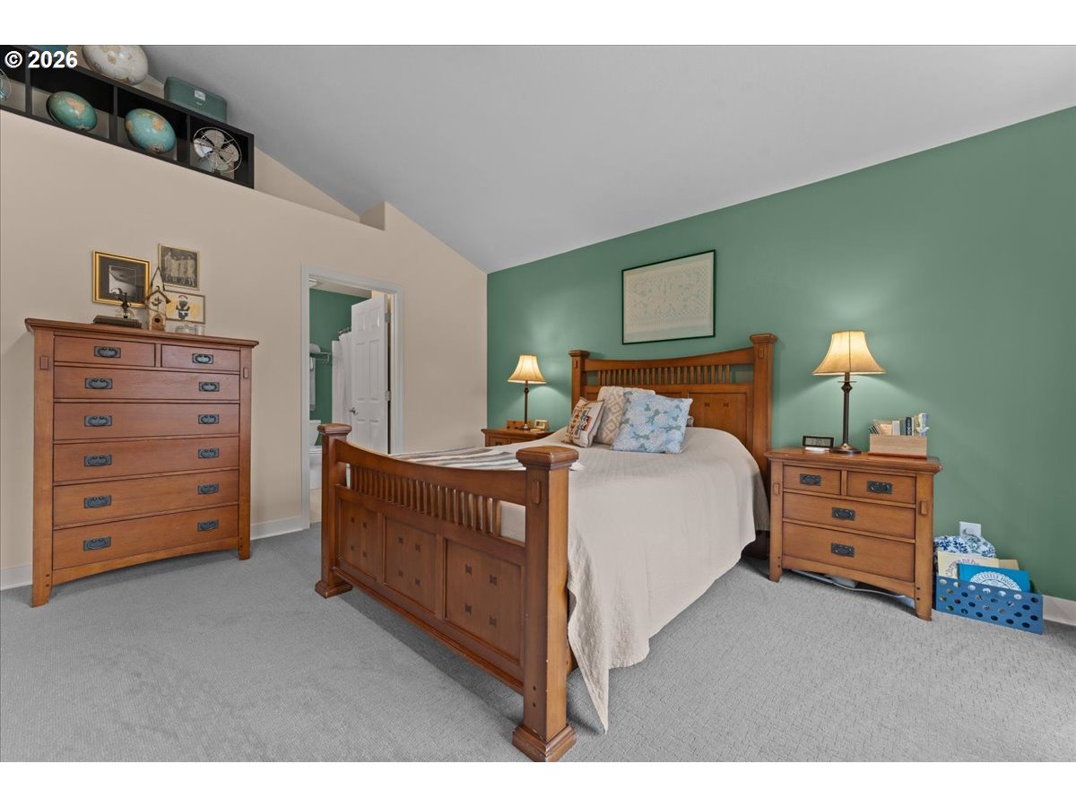 21123 Osburn Loop Fairview, OR 97024 - Photo 26 of 48 a bedroom with a bed and furniture