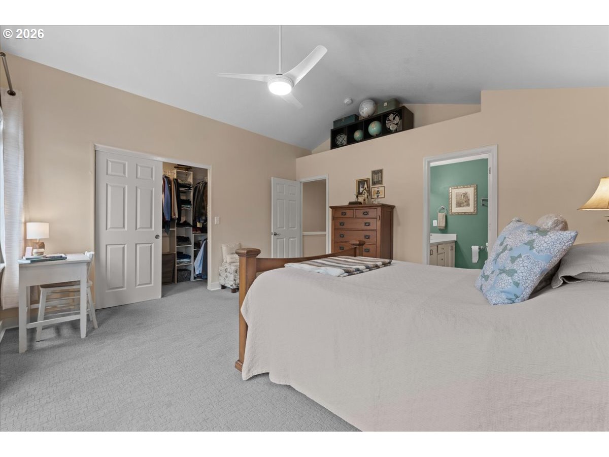21123 Osburn Loop Fairview, OR 97024 - Photo 27 of 48 a spacious bedroom with a bed and a cabinets