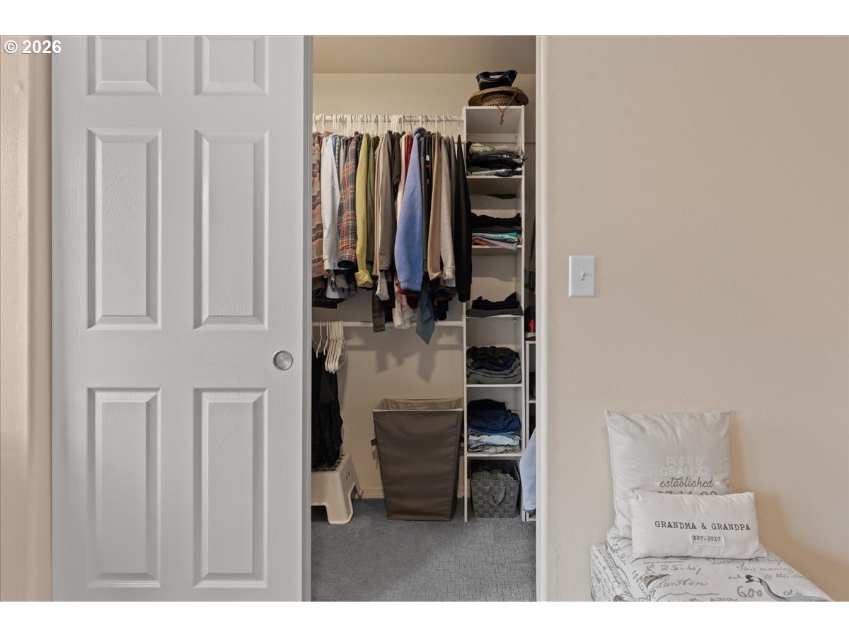 21123 Osburn Loop Fairview, OR 97024 - Photo 28 of 48 a view of walk in closet with clothes and shoes