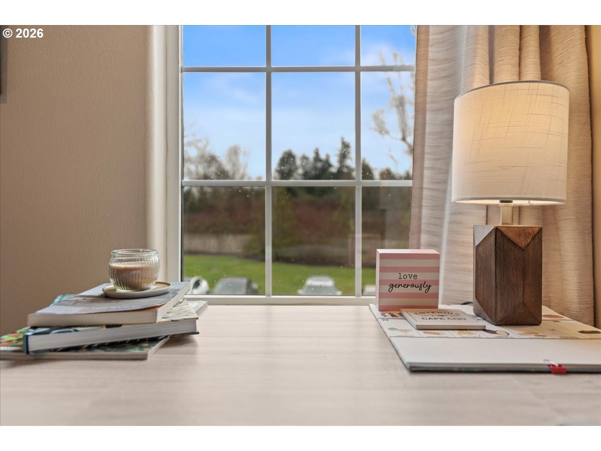 21123 Osburn Loop Fairview, OR 97024 - Photo 29 of 48 a living room with a large window and a fireplace