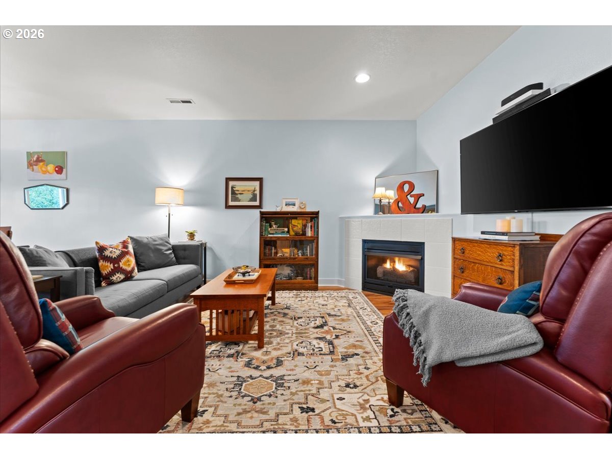 21123 Osburn Loop Fairview, OR 97024 - Photo 3 of 48 a living room with furniture and a flat screen tv