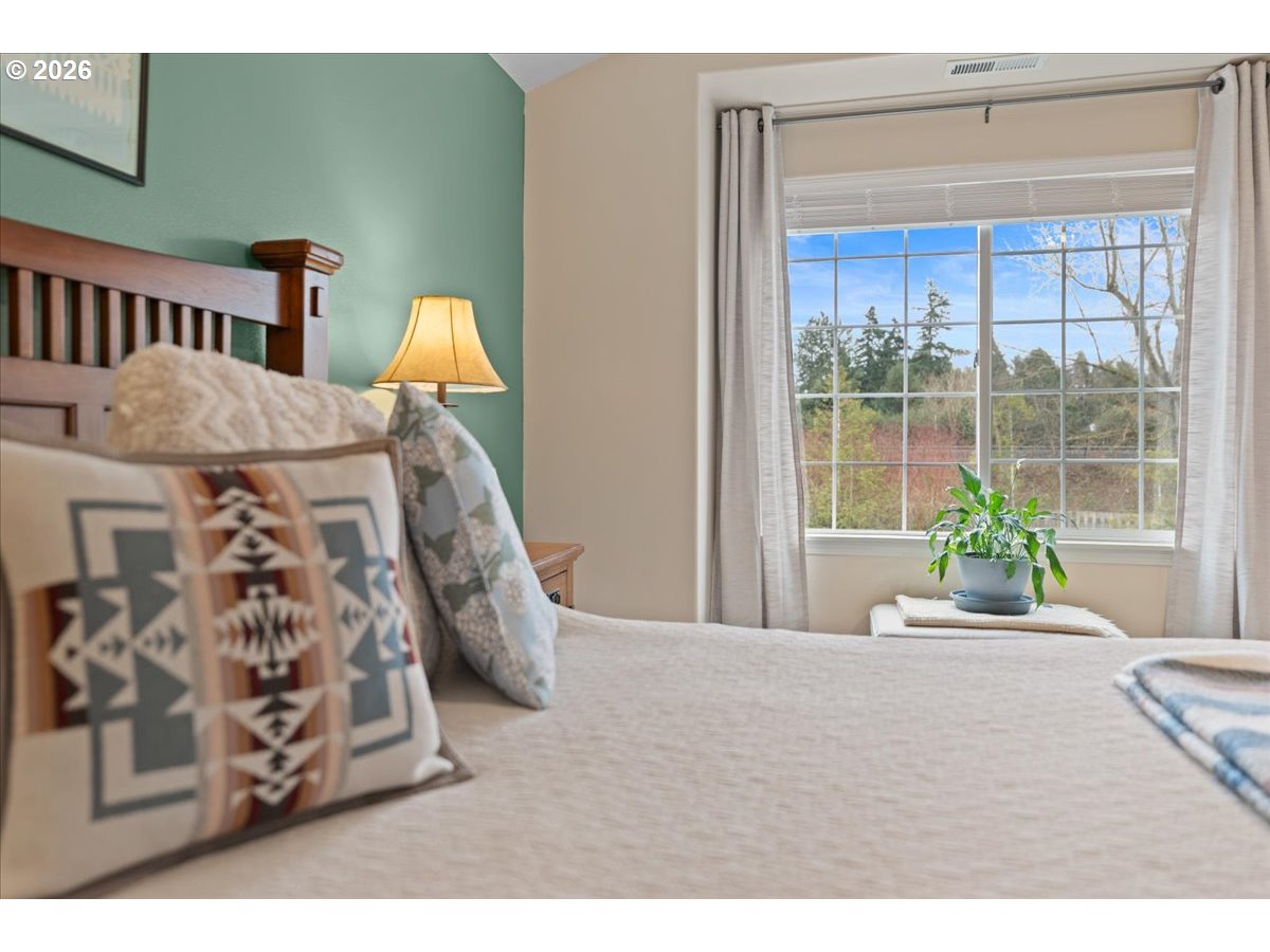 21123 Osburn Loop Fairview, OR 97024 - Photo 31 of 48 a bedroom with furniture and a large window