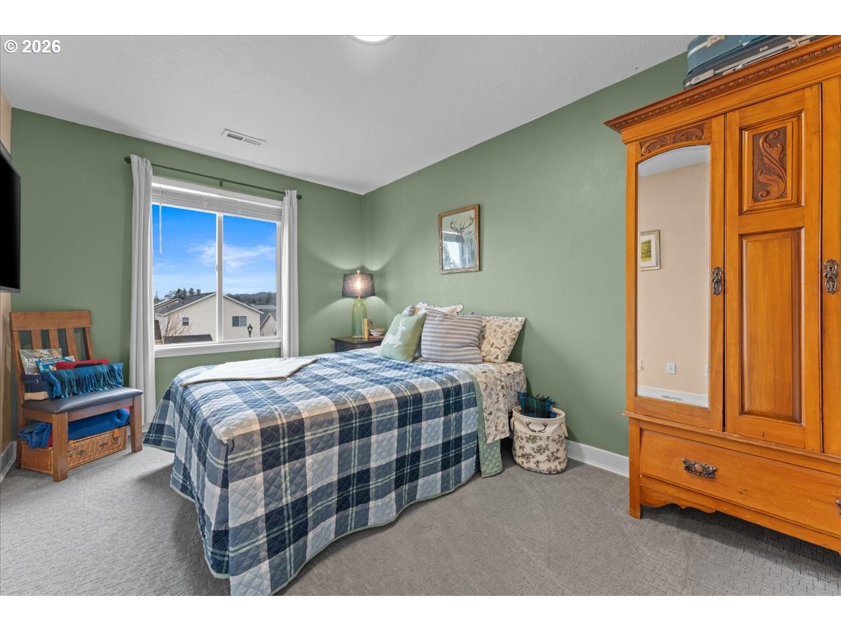 21123 Osburn Loop Fairview, OR 97024 - Photo 36 of 48 a bedroom with a bed and a window