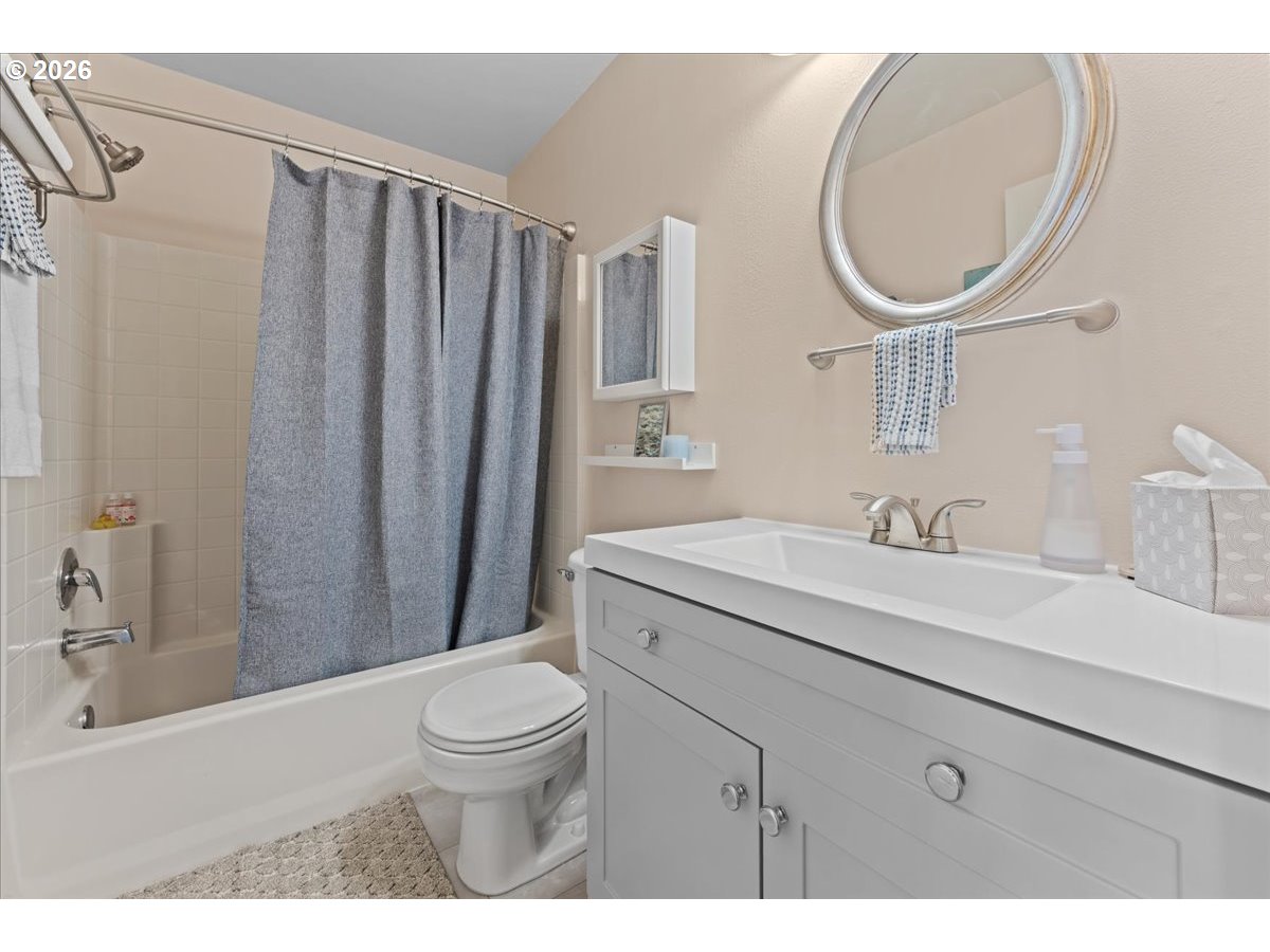 21123 Osburn Loop Fairview, OR 97024 - Photo 39 of 48 a bathroom with a sink a toilet and a mirror