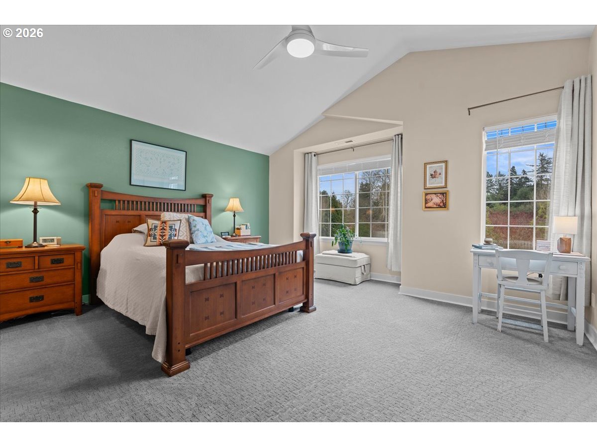 21123 Osburn Loop Fairview, OR 97024 - Photo 4 of 48 a bedroom with a bed and windows