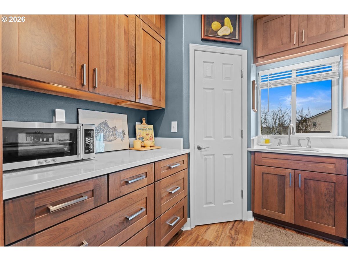 21123 Osburn Loop Fairview, OR 97024 - Photo 9 of 48 a kitchen with stainless steel appliances granite countertop a refrigerator and a cabinets