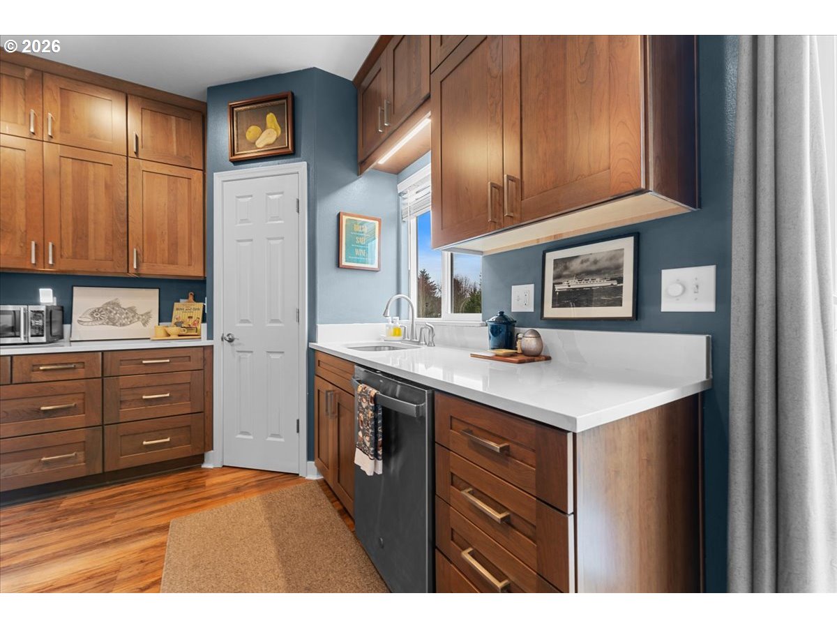 21123 Osburn Loop Fairview, OR 97024 - Photo 10 of 48 a kitchen with a sink and cabinets