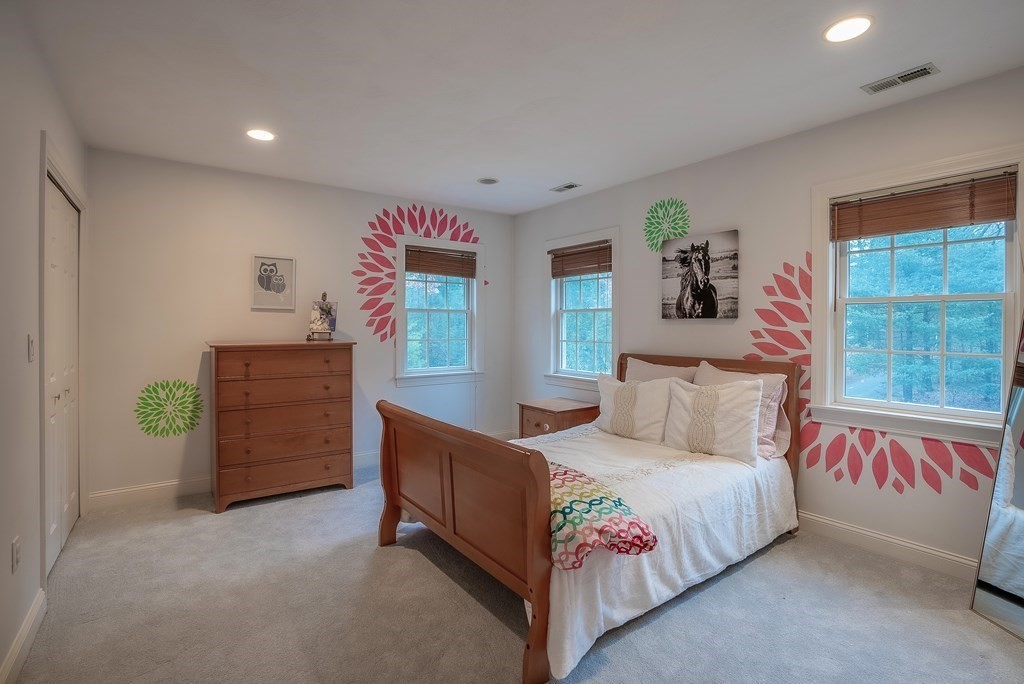 17 Rock Brook Way Boxford, MA 01921 - Photo 27 of 39 a bedroom with a bed and a dresser in it