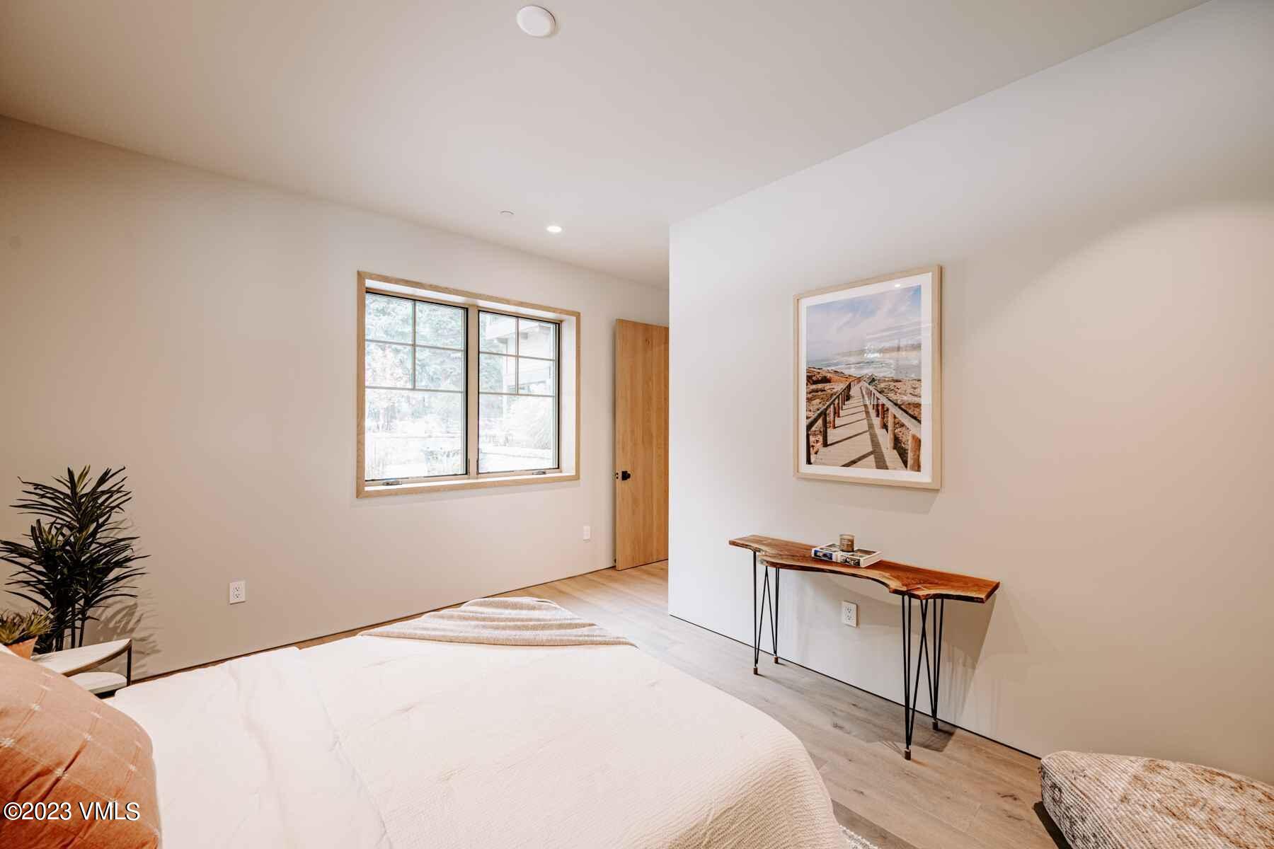 1033 Homestake Circle Vail, CO 81657 - Photo 11 of 30 a bedroom with a bed and a window