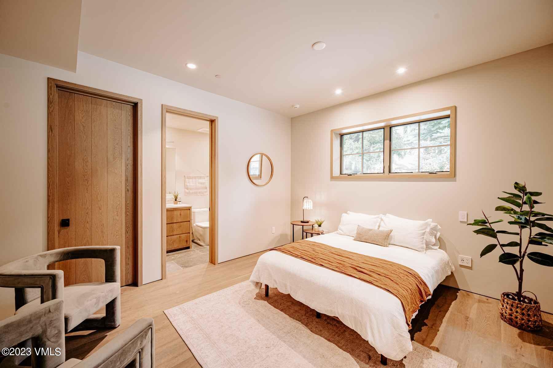 1033 Homestake Circle Vail, CO 81657 - Photo 13 of 30 a bedroom with a bed and a dresser
