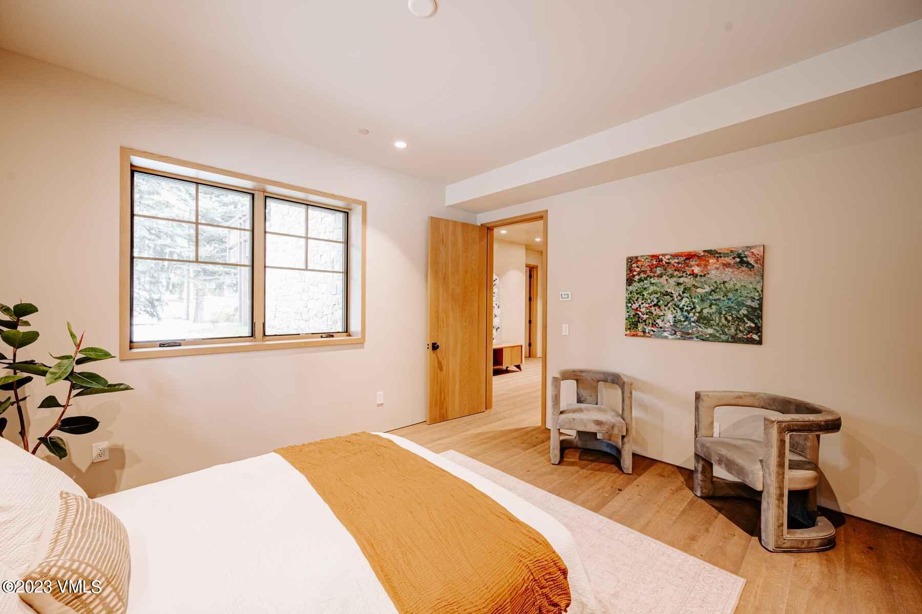 1033 Homestake Circle Vail, CO 81657 - Photo 14 of 30 a bedroom with a bed and a window