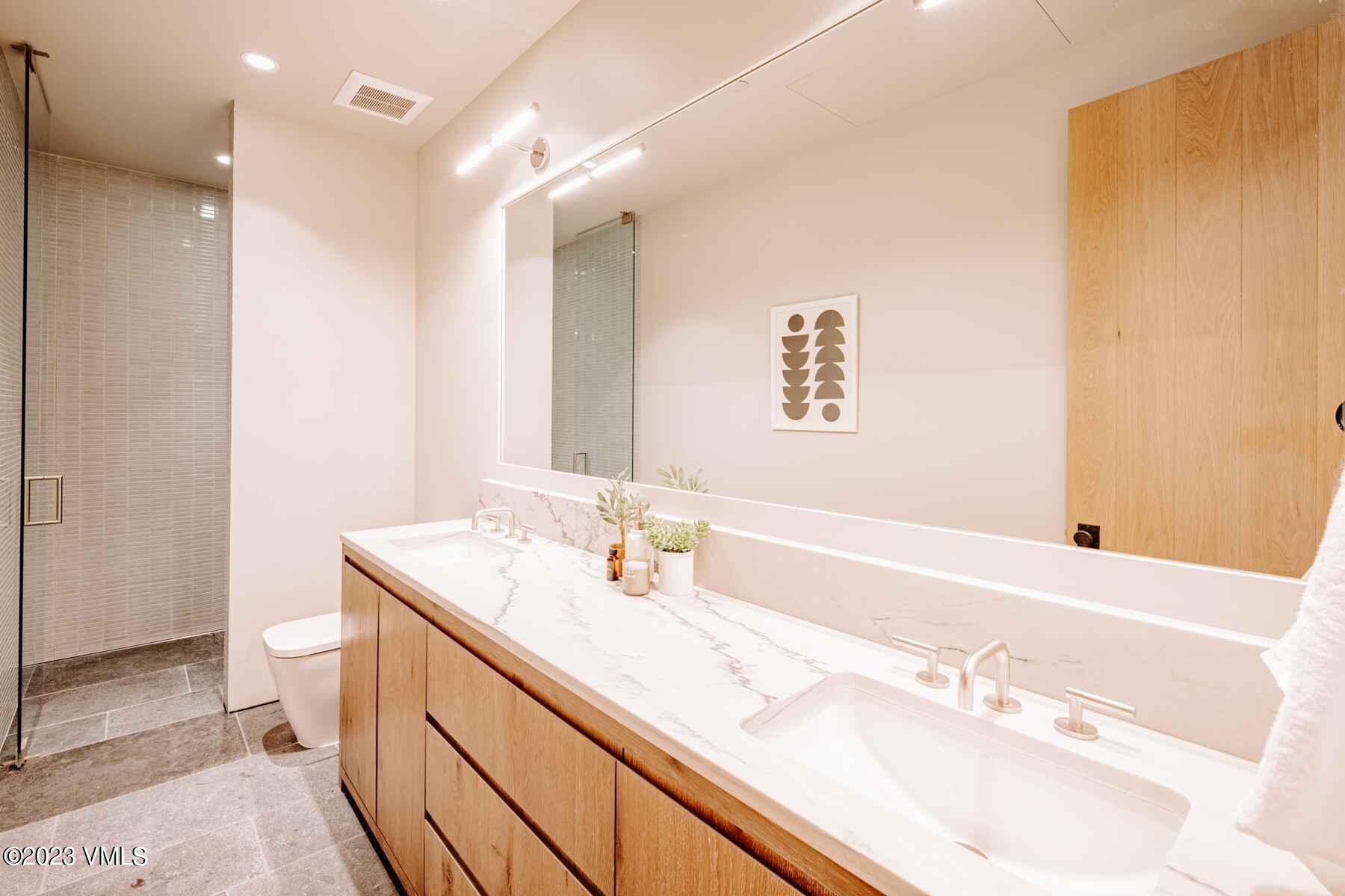 1033 Homestake Circle Vail, CO 81657 - Photo 20 of 30 a bathroom with a sink and a mirror