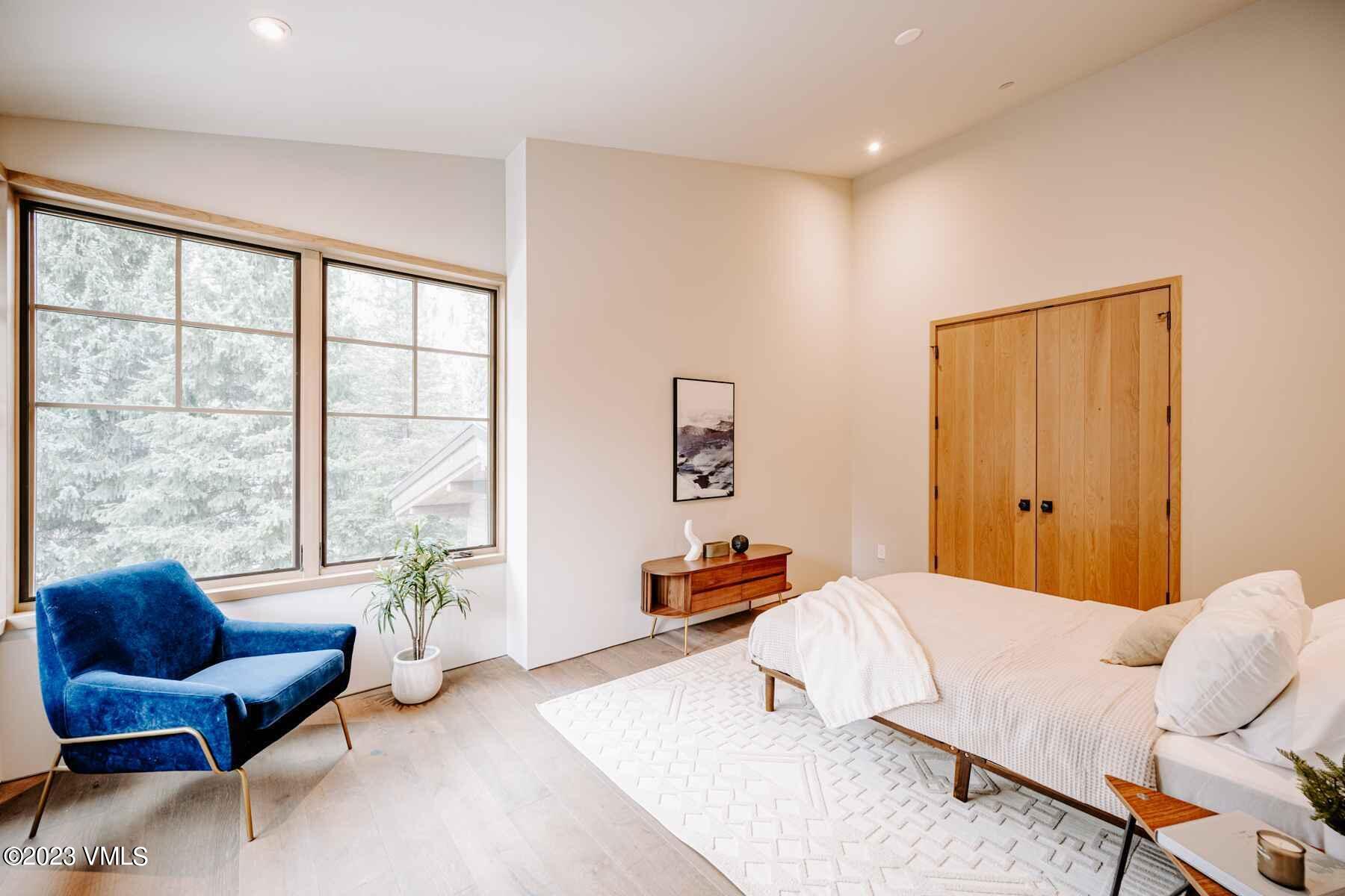 1033 Homestake Circle Vail, CO 81657 - Photo 21 of 30 a bedroom with furniture and a large window