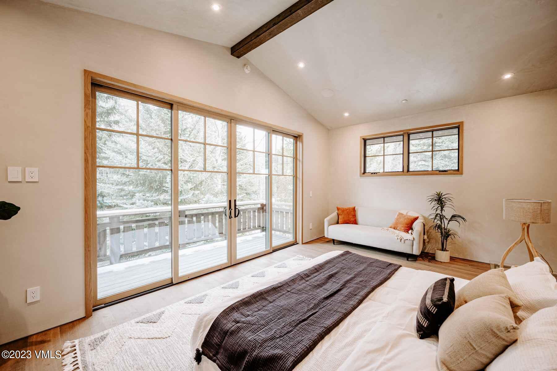 1033 Homestake Circle Vail, CO 81657 - Photo 24 of 30 a bedroom with furniture and a large window