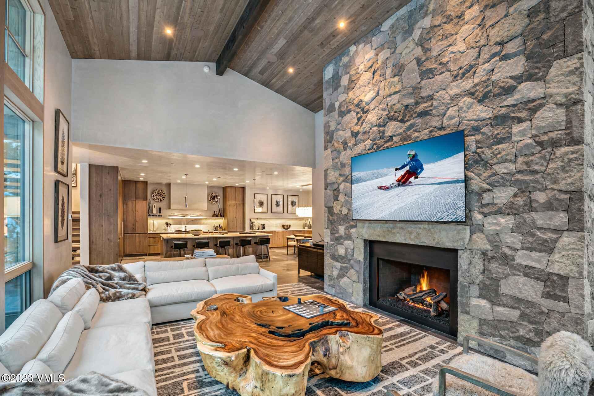 1033 Homestake Circle Vail, CO 81657 - Photo 4 of 30 a living room with furniture and a fireplace